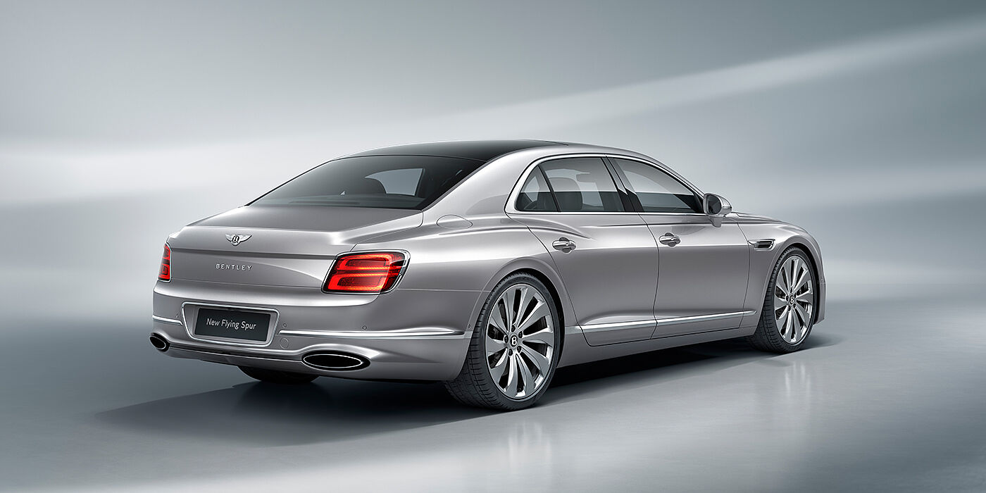 Bentley Yerevan New Bentley Flying Spur sedan rear view in Silverlake paint with ten spoke wheels and chrome matrix grille