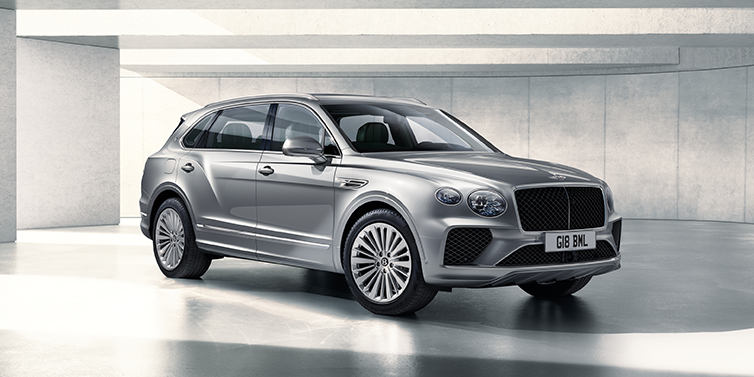 Bentley Yerevan Bentley Bentayga Extended Wheelbase SUV front three quarter in Moonbeam paint with a grey background