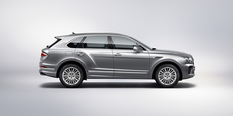 Bentley Yerevan Bentley Bentayga SUV side profile in Moonbeam silver paint against white background featuring 21 inch 5 spoke wheels